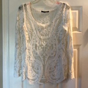 Beautiful sheer, lace off white top where with tan